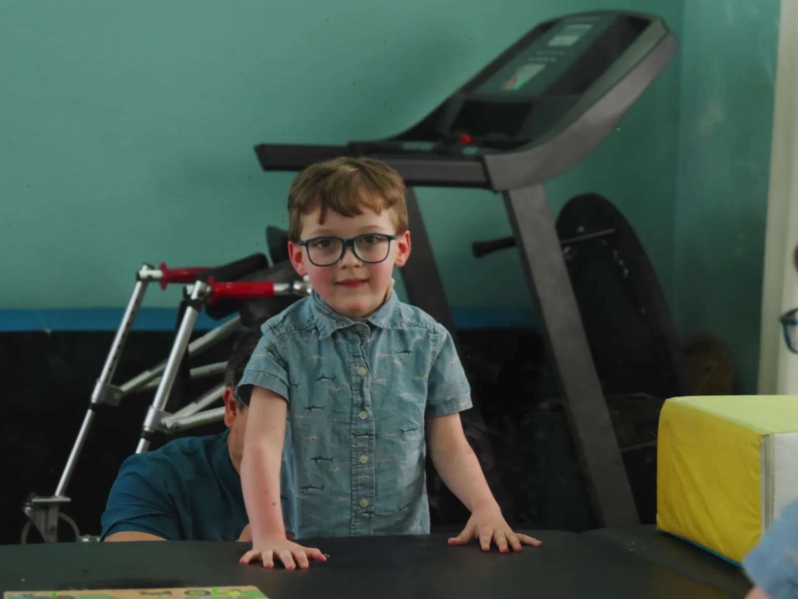 Child participating in a guided mirror-based therapy activity